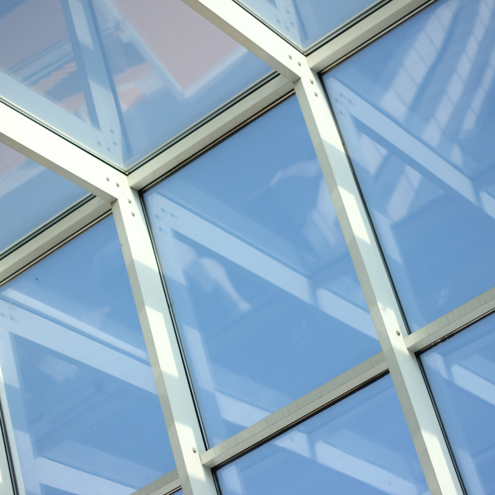 Aluminum skylights installed in a sloped roof, showcasing their sleek design and ability to blend with various architectural styles